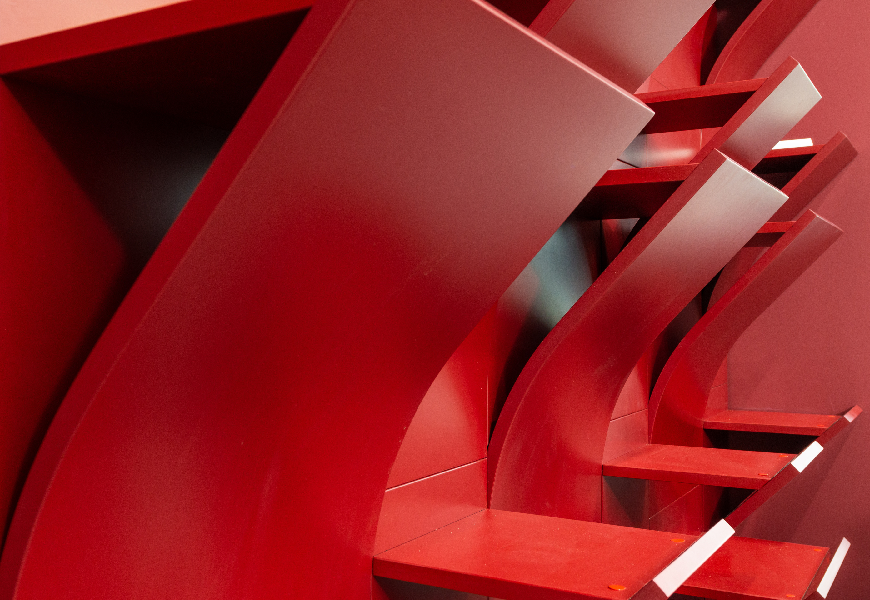 Modern red shelves on wall in room